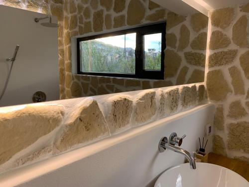 a bathroom with a sink and a mirror at Spring-Пролет Apartment, Old Town, Veliko Tărnovo in Veliko Tŭrnovo