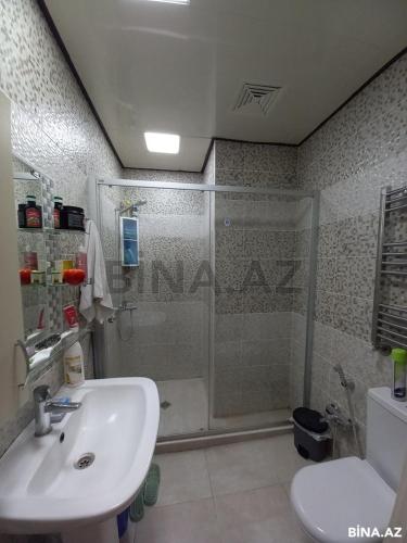 a bathroom with a shower and a sink and a toilet at Private cozy room next to metro Garayev in Baku