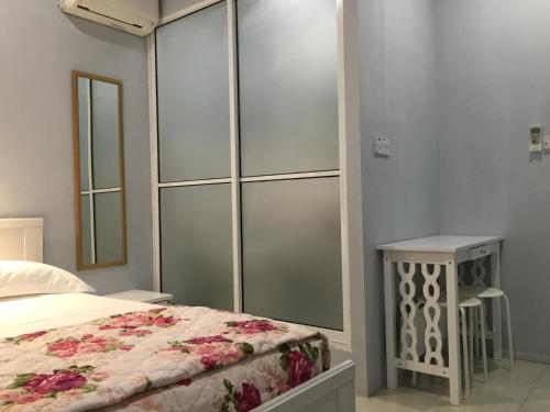 a bedroom with a bed and a large closet at The Second Room in Ranau