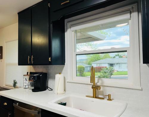 a kitchen counter with a sink and a window at Immaculate Charming Duplex-1Unit in Oroville