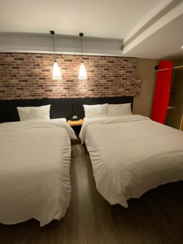 Una cama o camas en una habitación de 苓旅中山館-Lininn ZhongShan