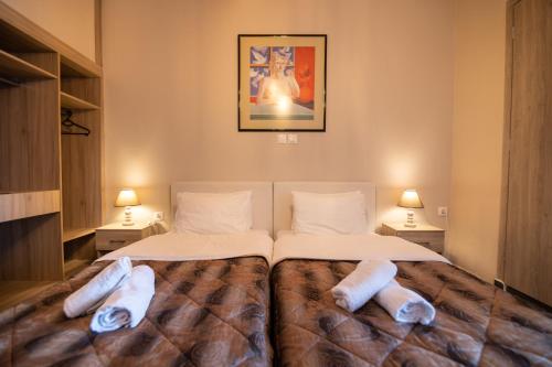 Postel nebo postele na pokoji v ubytování Votsalakia Hotel & Luxury Apartments