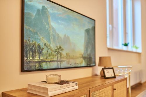 a living room with a large painting on the wall at Casita Loft in Ludwigshafen am Rhein