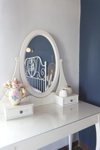 a dressing table with a mirror on top of it at Sunset in Megalochori