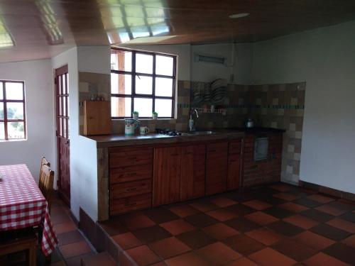 a kitchen with a sink and a counter top at La Reliquia - Tausa in Barranquilla