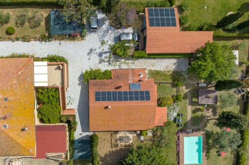 an overhead view of a house with solar panels on it at Podere Isabella in San Vincenzo