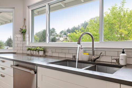 a kitchen with a sink and a window at Marbella Lane - Charming & Serene home in Pacifica in Pacifica