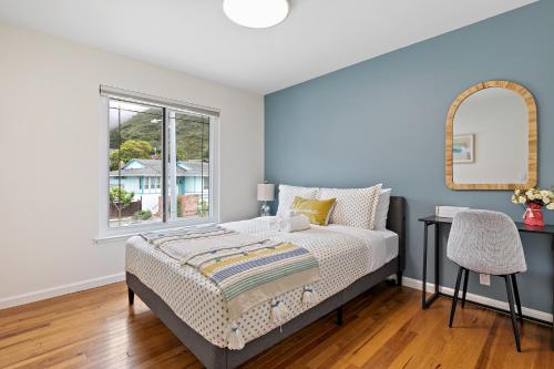 a bedroom with a bed and a window at Marbella Lane - Charming & Serene home in Pacifica in Pacifica