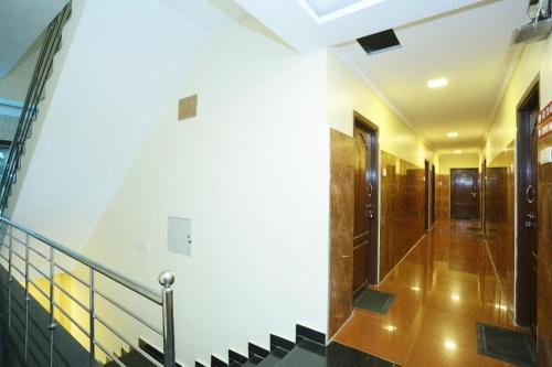 a staircase in a building with a stair case at Hotel Jeyam in Kanyakumari