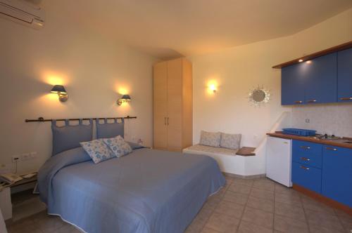 Postel nebo postele na pokoji v ubytování Summer Time - Tinos Apartments