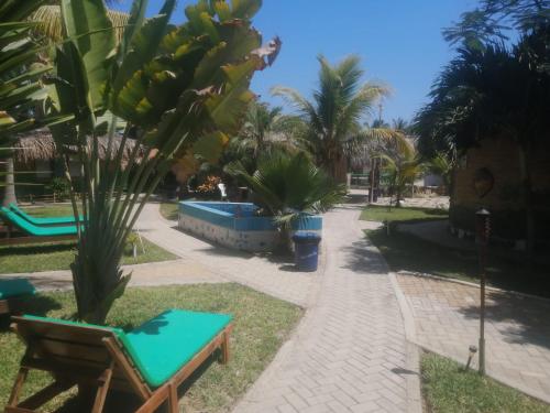 a park with a bunch of bananas hanging from a tree at Bora Bora Bungalows in Los Órganos