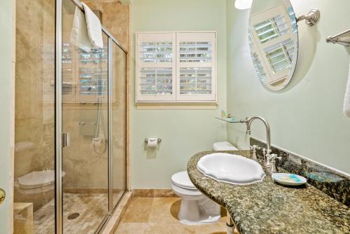 a bathroom with a sink and a toilet and a shower at Apple Farm Inn in San Luis Obispo