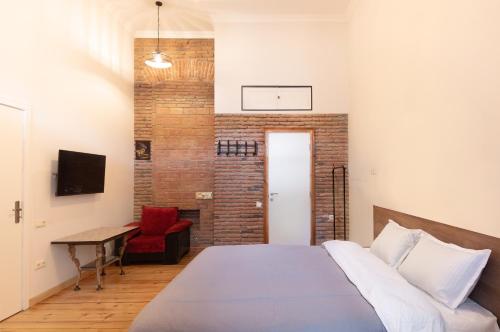 a bedroom with a bed and a basketball hoop on the wall at Apartment in old TBILISI in Tbilisi City