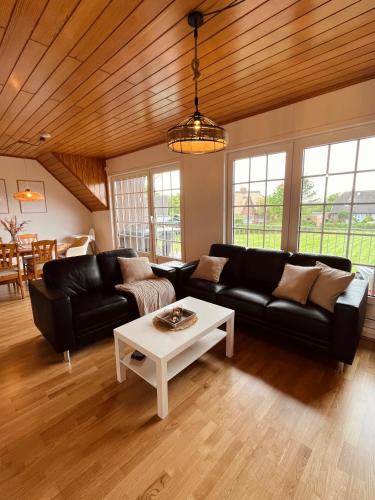 Ruang duduk di Frieda - Ferienwohnung mit Deichblick