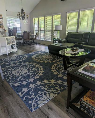 a living room with a couch and a table at Lake ConRoy Estates - Unit A with Pool Access in Montgomery