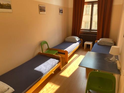 Una cama o camas en una habitación de Hostel EMMA