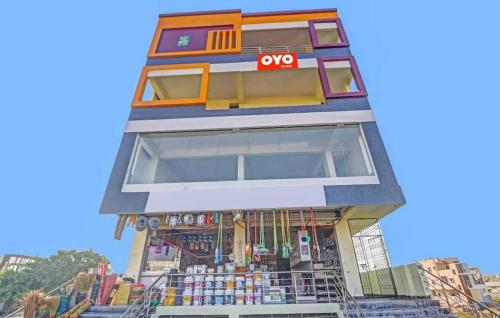a building with an oop store in front of it at OYO Flagship Hotel Mint Residency in New Delhi