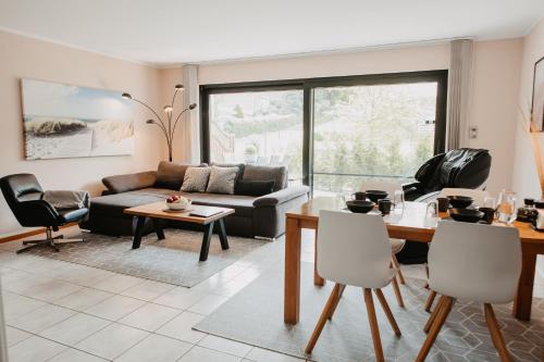 Зона вітальні в Stylisches modernes Apartment, Sauna und Wellness Top Lage