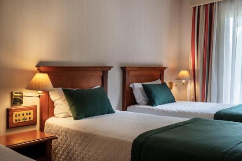 Ένα ή περισσότερα κρεβάτια σε δωμάτιο στο Hotel Alpestre