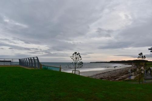 a view of a beach with the ocean in the background at Ballywalter Beach House in Ballywalter