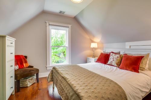 a bedroom with a large bed and a window at Historic and Charming Salem Home with Mill Creek Views! in Salem