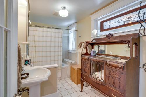 a bathroom with a sink and a mirror at Historic and Charming Salem Home with Mill Creek Views! in Salem