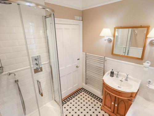 a bathroom with a sink and a shower at Grisedale View in Keswick