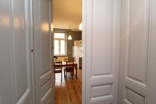 a view of a room with a dining room at Blue Dollar Apartament in Przemyśl