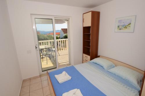 Ένα ή περισσότερα κρεβάτια σε δωμάτιο στο Apartman Jadra