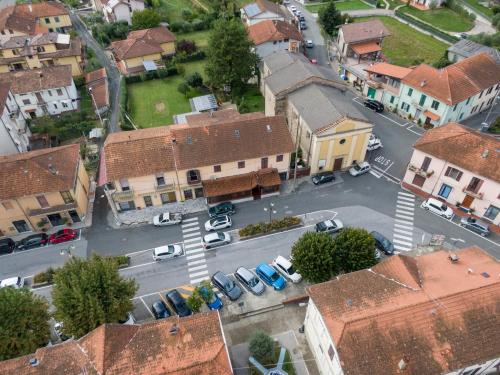 an aerial view of a town with cars parked in a parking lot at La Sosta in Lunigiana in Monti di Licciana Nardi