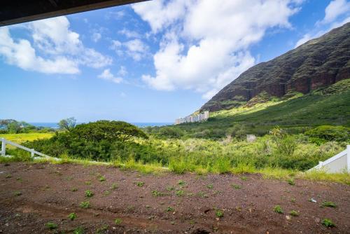 a dirt field with mountains in the background at @ Marbella Lane - Mesmerizing Ocean + MT Views in Waianae