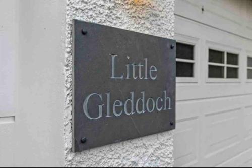 a sign on the side of a building at Little Gleddoch in Dumbarton