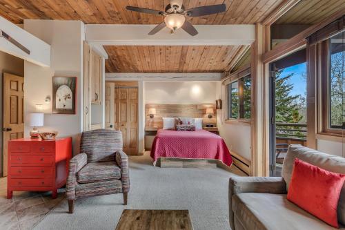 a bedroom with a bed and a ceiling fan at Laurelwood Condominiums 309 in Snowmass Village