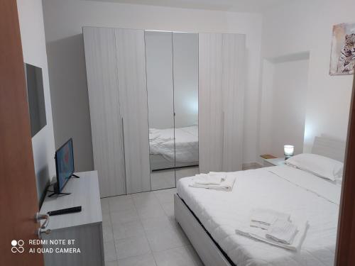 Postel nebo postele na pokoji v ubytování La casetta di Alessandro