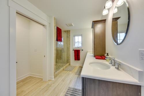 a bathroom with a sink and a mirror at Lakefront Burlington Vacation Rental Dock and Beach in Twin Lakes