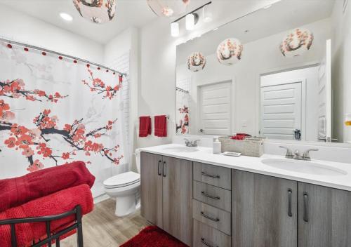 a bathroom with a sink and a toilet and a tub at Luxurious 1 Bedroom Apartment Near Braves Stadium in Atlanta