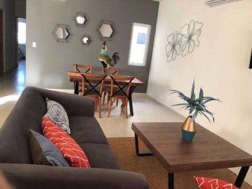 a living room with a couch and a table at TERRARiA APARTMENT NO 3 in La Paz
