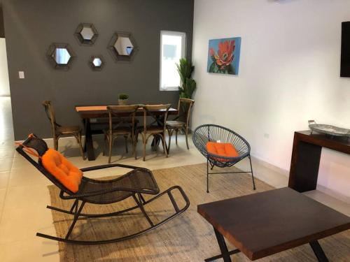 a living room with a dining table and chairs at TERRARiA APARTMENT NO 3 in La Paz