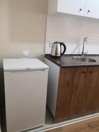 EST Suite Apartにあるキッチンまたは簡易キッチン