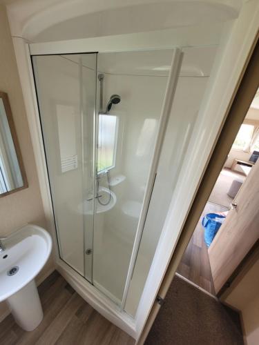 a glass shower in a bathroom with a sink at 188 Holiday Resort Unity Brean - Central Location Pet Stays Free - Passes included in Brean