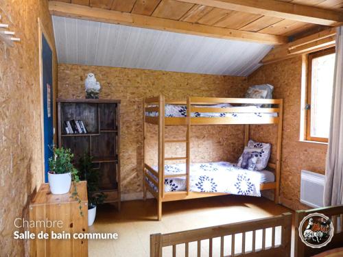 a room with bunk beds in a house at Parc animalier du Hérisson in Doucier