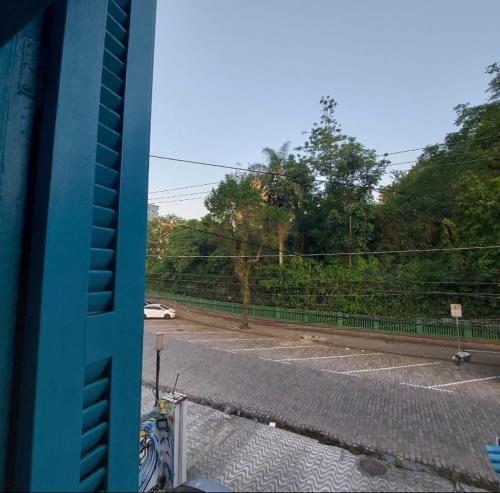 a view of a parking lot from a bus at Rolds Hostel in Santos