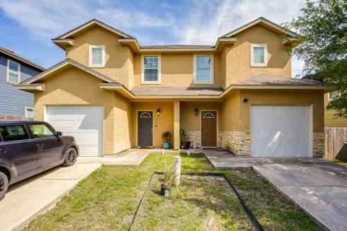 a house with a car parked in front of it at San Antonio Townhome about 2 Mi to Aquarium! in San Antonio
