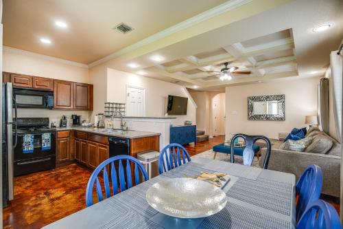 a kitchen and living room with a table and chairs at San Antonio Townhome about 2 Mi to Aquarium! in San Antonio
