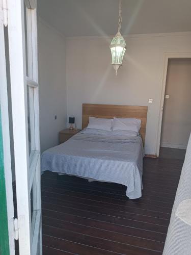 a bedroom with a large bed with white sheets at Céntrico melilla in Melilla