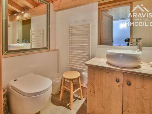 a bathroom with a white toilet and a sink at Appartement Le Grand-Bornand, 5 pièces, 8 personnes - FR-1-391-96 in Le Grand-Bornand