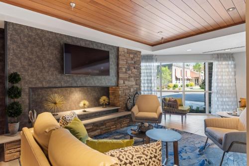 a living room with a couch and a fireplace at Fairfield Inn & Suites by Marriott Hickory in Hickory