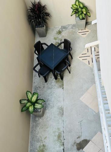 an overhead view of a table and chairs and plants at Large 2-Bedroom Apartment, close to the American Consulate in Guayaquil
