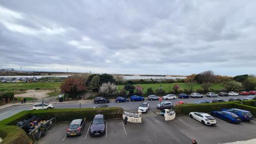 a parking lot with many cars parked in it at The Royal Hotel in Liverpool