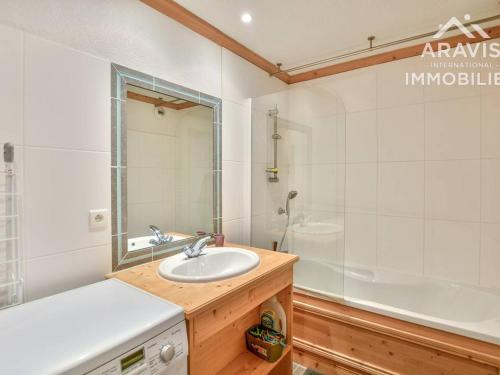 a bathroom with a sink and a shower and a tub at Appartement Le Grand-Bornand, 3 pièces, 5 personnes - FR-1-391-132 in Le Grand-Bornand